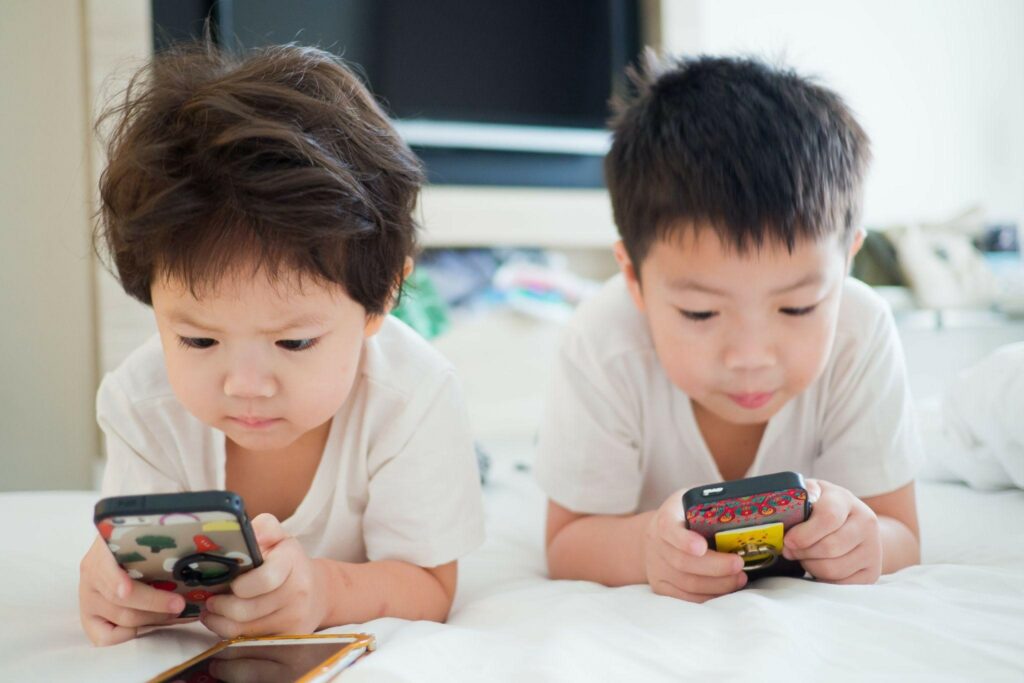 How should parents deal with young children who are overly addicted to cell phone games?